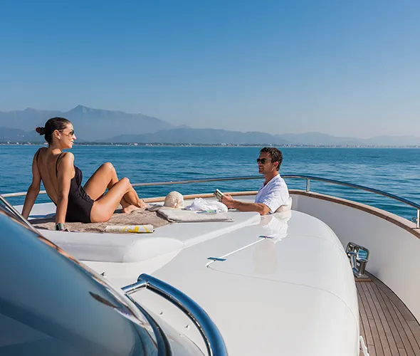 Happy couple enjoying a relaxing moment on a cruise deck.